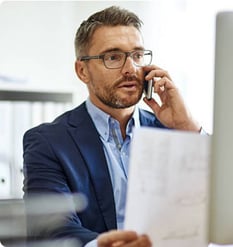 businessman-working-at-computer-2x