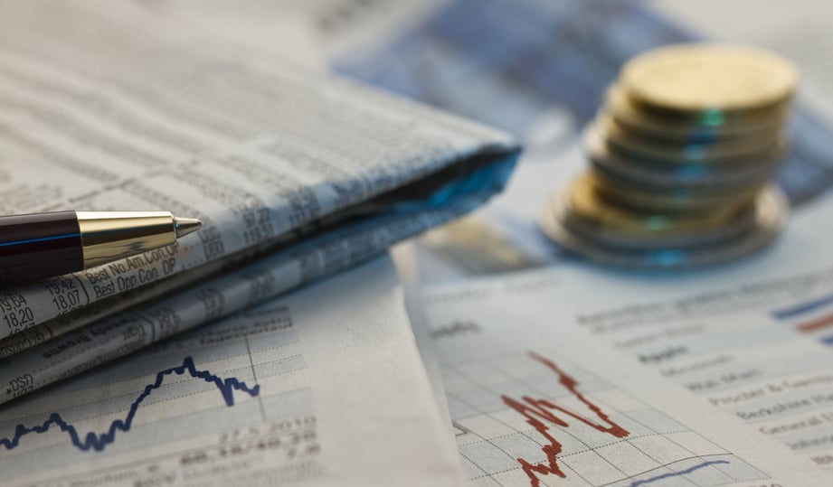 financial-newspaper-with-pen-and-stack-of-coins s2