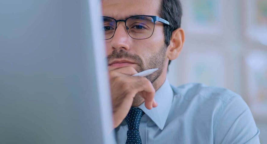 thoughtful-man-looking-at-computer-1